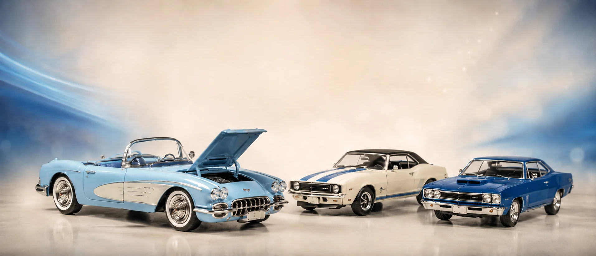 Three die-cast muscle car models lined up under warm studio light